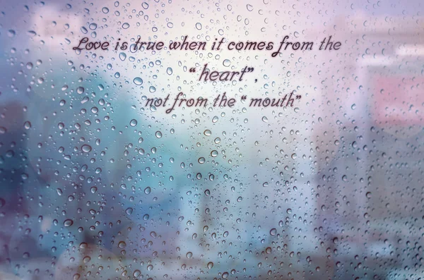 Waterdrops on glass window and qoutes — Stock Photo, Image