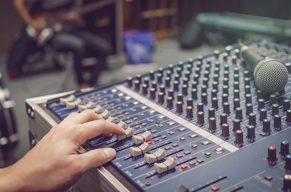 Hand adjusting audio mixer — Stock Photo, Image