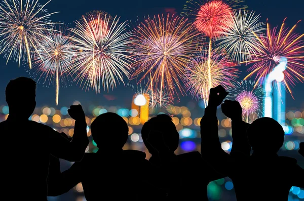People looks at New Year fireworks — Stock Photo, Image