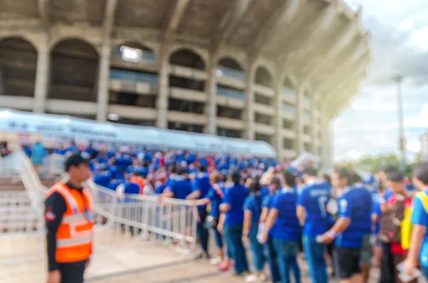 Fans sport in queue for entrance at stadium — Stock Photo, Image