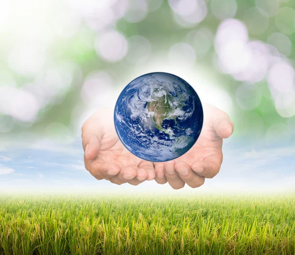 Earth over hands — Stock Photo, Image