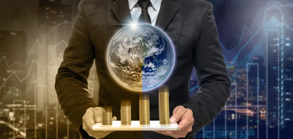 Businessman holding tablet with earth