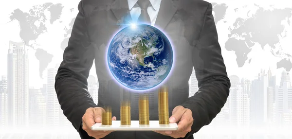 Businessman holding tablet with earth — Stock Photo, Image