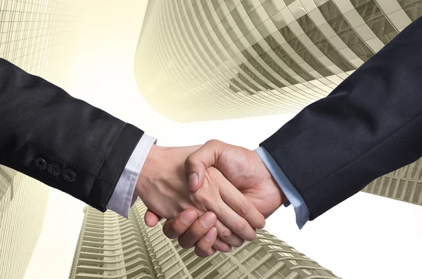 Handshake between businessmen — Stock Photo, Image