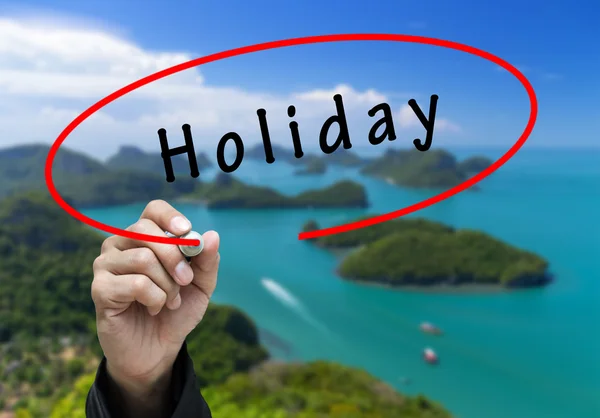 Man Hand skriva Holiday — Stockfoto