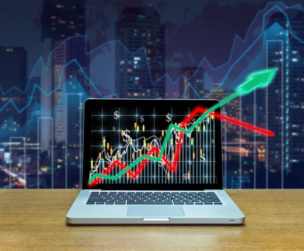 Stock exchange market graph on laptop — Stock Photo, Image