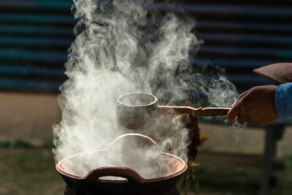 Handle spoon dipper over pot — Stock Photo, Image