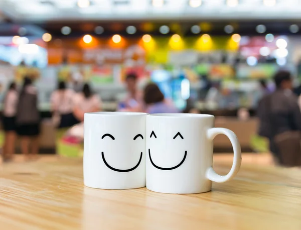Two happy cups in coffee store — Stock Photo, Image