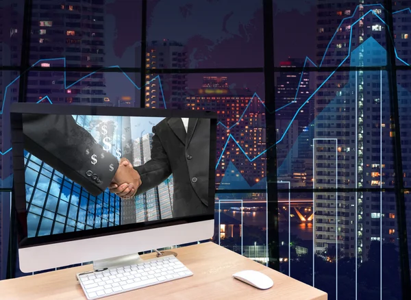 Computer with handshake between businessman — Stock Photo, Image