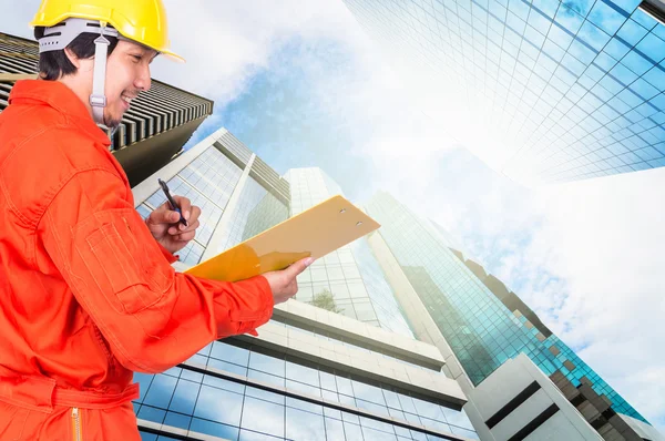 Asian engineer writing note — Stock Photo, Image