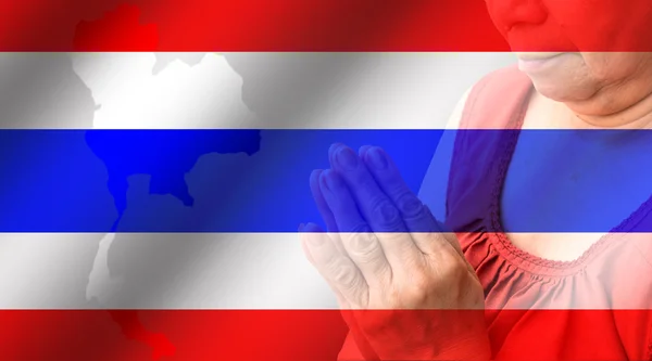 Old woman praying with Thailand flag — Stock Photo, Image