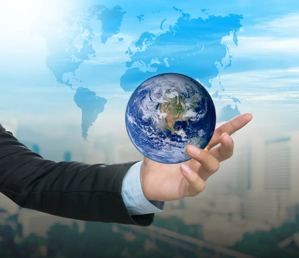 Earth and world map over hand — Stock Photo, Image