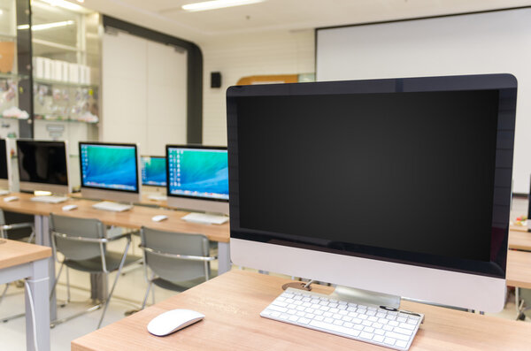 Rows of computers in computer room 