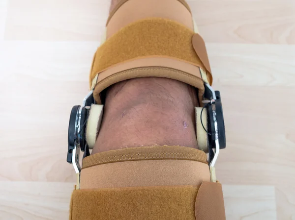 Close up knee brace support for leg or knee injury — Stock Photo, Image