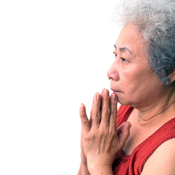 祷告在白色背景上的老女人 — 图库照片