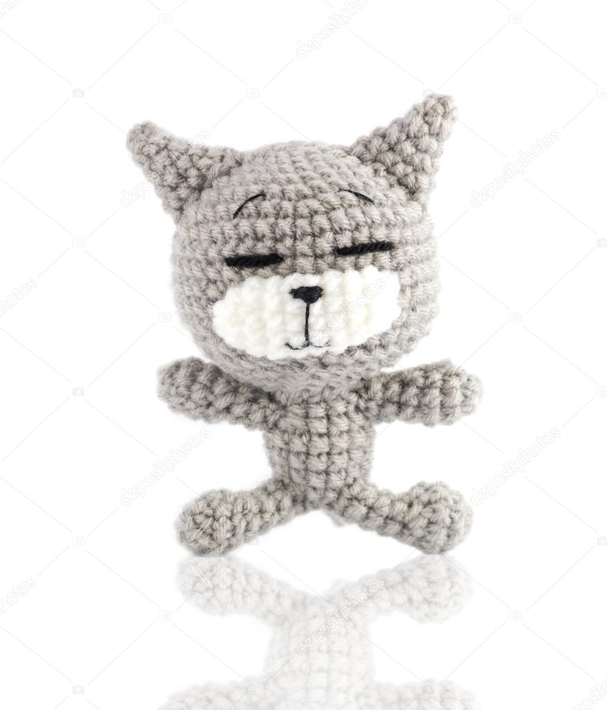 handmade crochet gray cat doll on white background