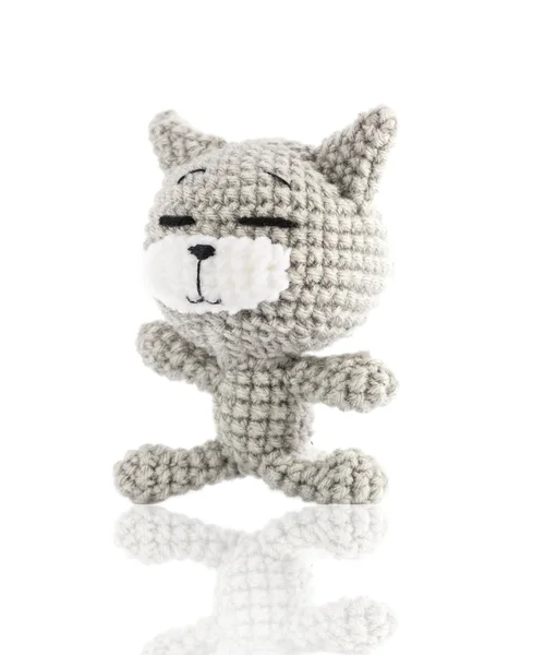 Handmade crochet gray cat doll on white background, left side — Stock Photo, Image