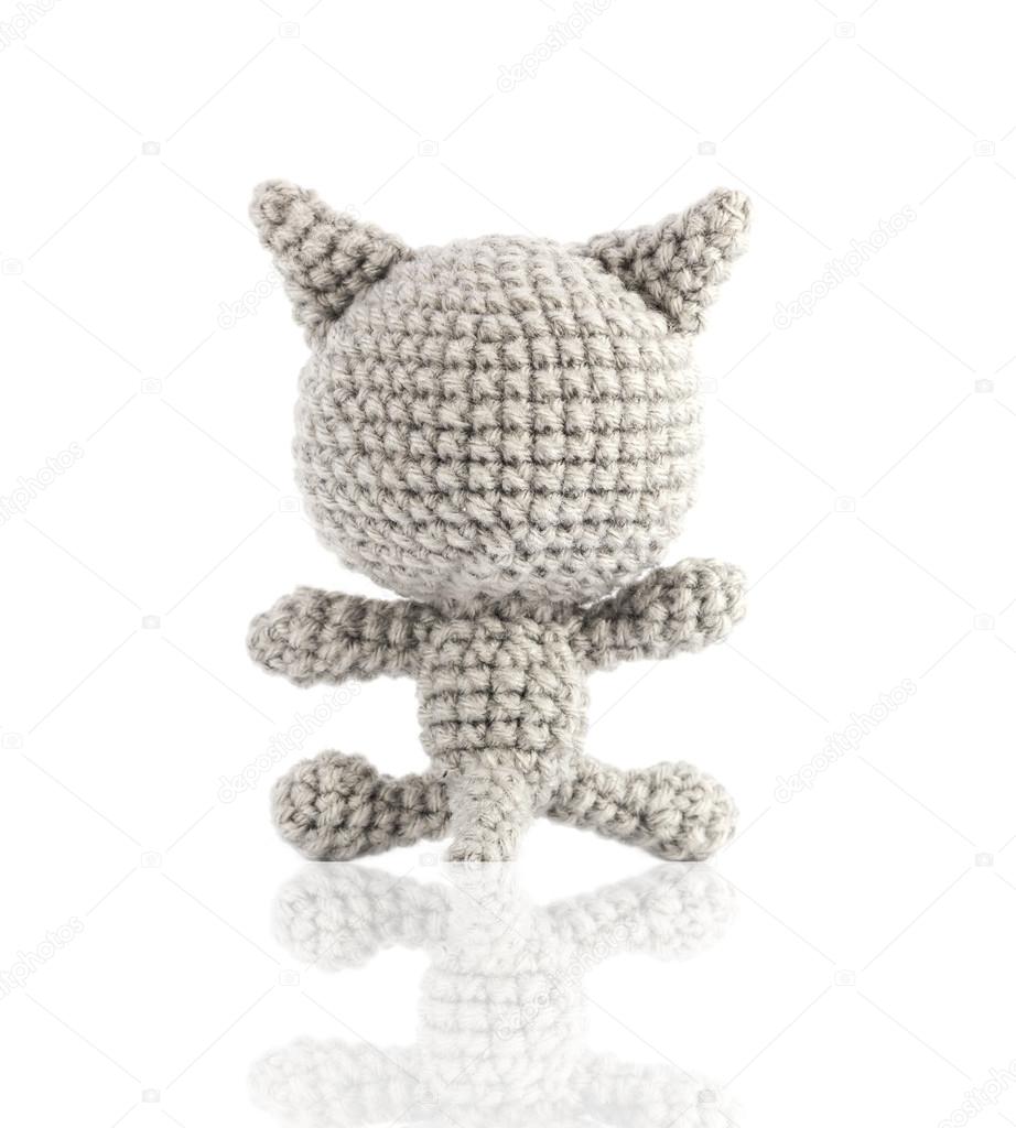 handmade crochet gray cat doll on white background, back side