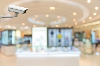Güvenlik kamerası bokeh arka plan ile kozmetik mağazası bulanıklık izleme
