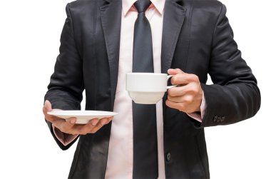 Kahve fincanı beyaz arka planda tutan işadamı