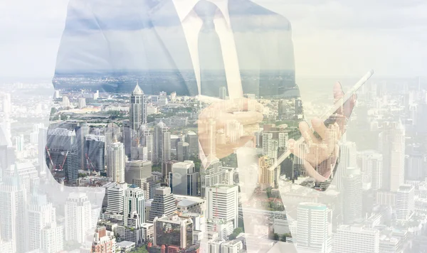 Double exposure of businessman with cityscape — Stock Photo, Image