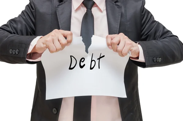 Businessman ripping up the Debt sign on white background — Stock Photo, Image