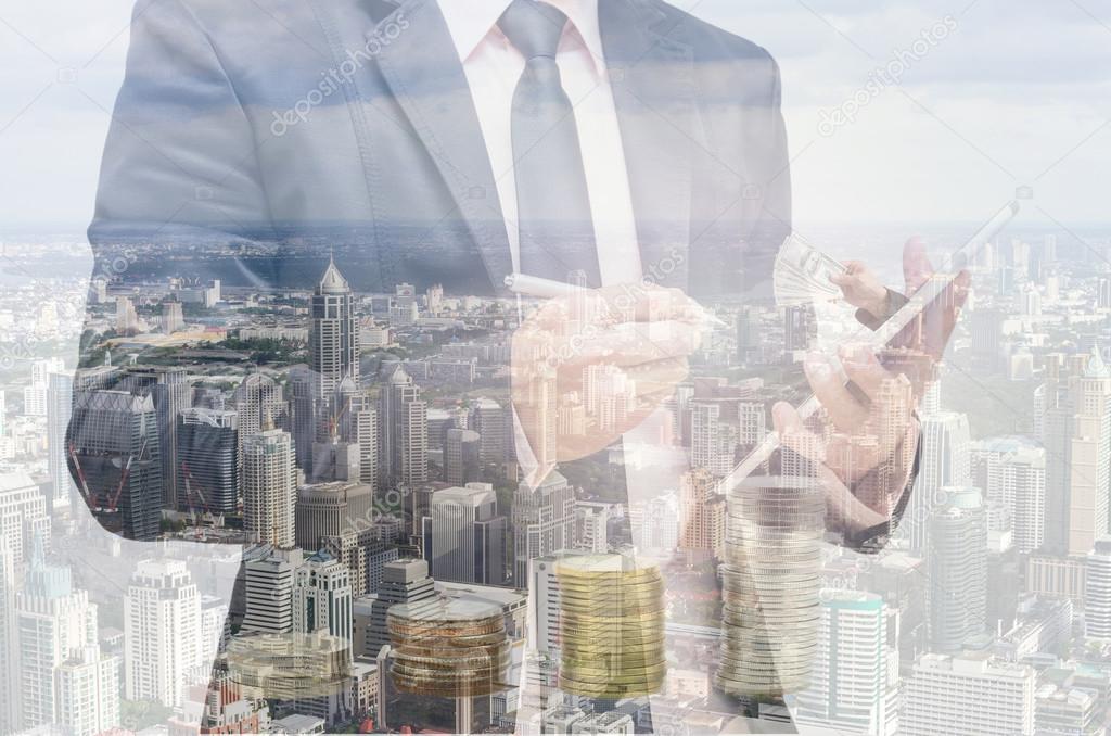 Double exposure of businessman with cityscape