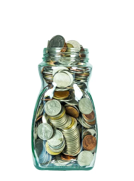 Botella de vidrio con monedas sobre fondo blanco, concepto de ahorro — Foto de Stock