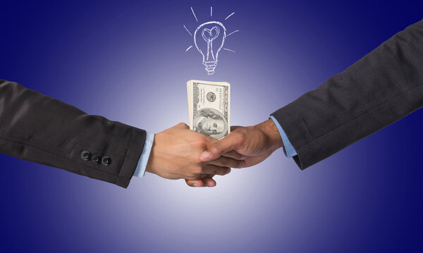 Hand shake between a businessman with dollar money for idea of s