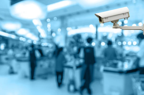 Security camera toezicht op de kassa winkel vervagen met bokeh achtergrondgeluid — Stockfoto