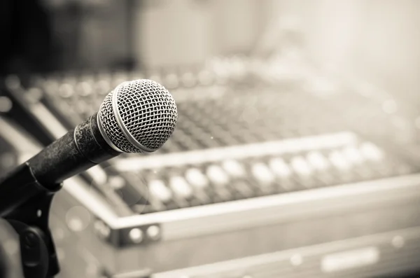 Close up of microphone on mixer blurred background — Stock Photo, Image