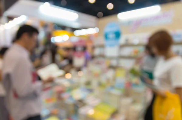 Abstract blurred photo of book store with people background