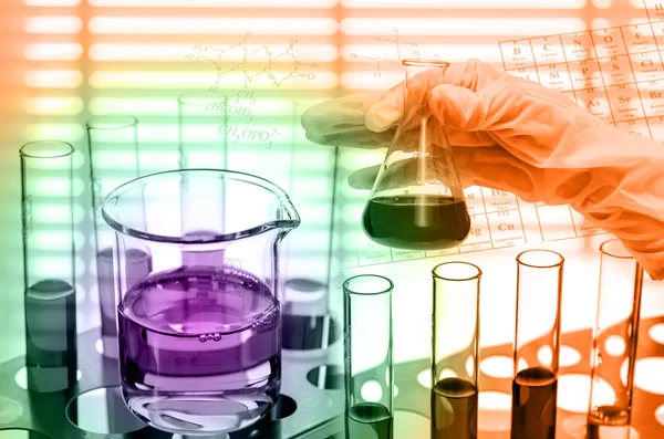Science laboratory research, Dropping chemical liquid to test tubes — Stock Photo, Image