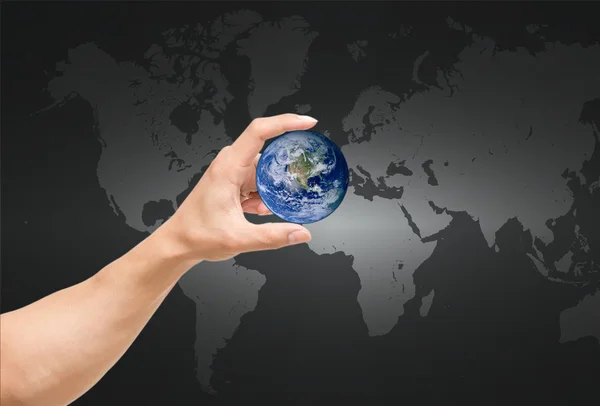 Man hand catching the earth on world map,Elements of this image  furnished by NASA — Stock Photo, Image