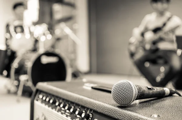 Closeup of microphone on musician blurred background