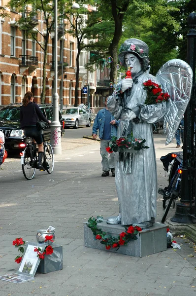 Human statue dressed as angel — Stock Photo, Image