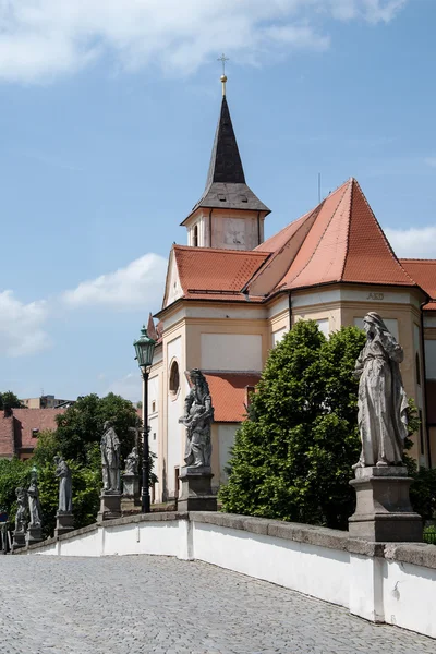 View of the old Baroque bridge and St. John the Baptist church in Namest nad Oslavou — Stock Photo, Image