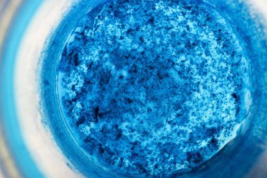 Sharp Focused Bottom Of Bottle As Background. Macro Photo Taken From Above. Blurred Throat