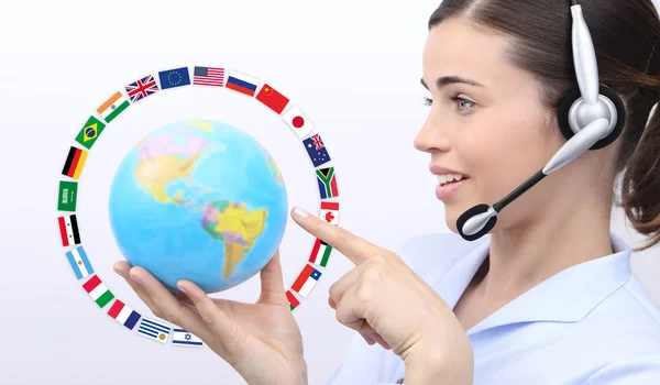 Customer service operator woman with headset pointing her finger — Stock Photo, Image