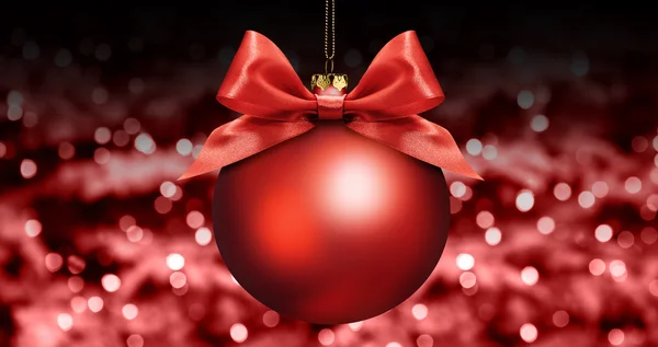 Bola de navidad con lazo de cinta de satén rojo en luces borrosas rojas b —  Fotos de Stock