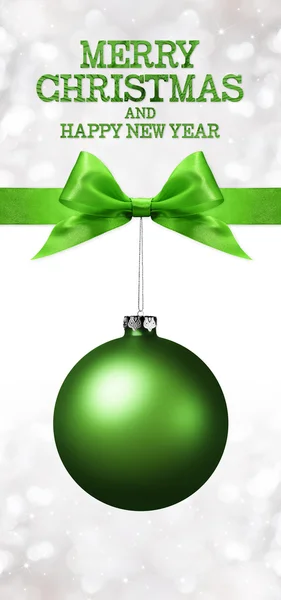 Merry christmas and happy new year text with green ball and ribbon — Stock Photo, Image