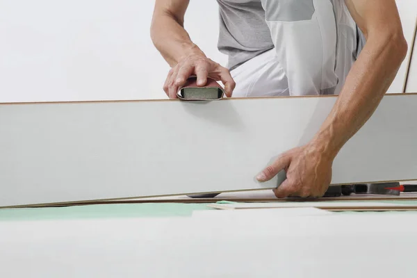 Worker Hands Installing Timber Laminate White Floor Precise Finishing Using — Stock Photo, Image