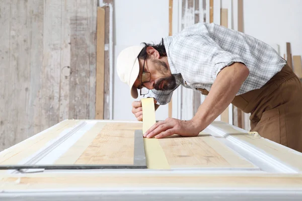 Male Carpenter Working Wood Carpentry Workshop Putting Paper Masking Tape — Stockfoto