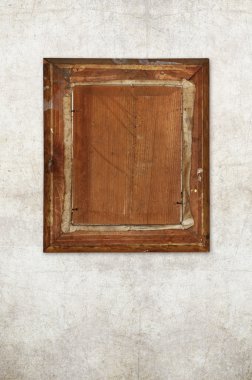 Back of old wooden picture frame on old wall clipart