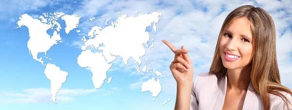 Smiling woman shows the international map — Stock Photo, Image