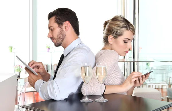 Happy couple at the bar with champagne and fruit cake, love — Stock Photo, Image