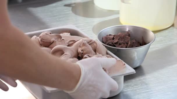 Chocolate ice cream, professional hands garnish — Stock Video