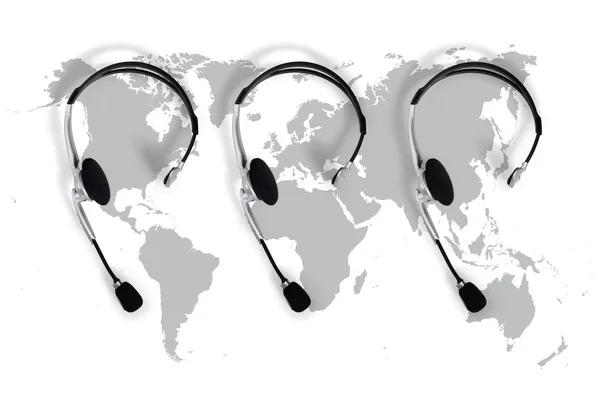 Kontaktní globální koncepce, pohled shora sluchátka a mapa — Stock fotografie