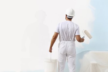 painter man at work with a paint roller and bucket, wall paintin clipart
