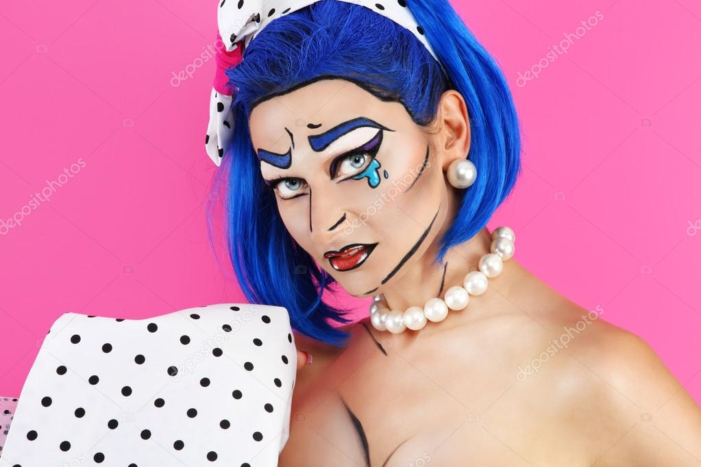 portrait pop model makeup with blue wig, on pink background